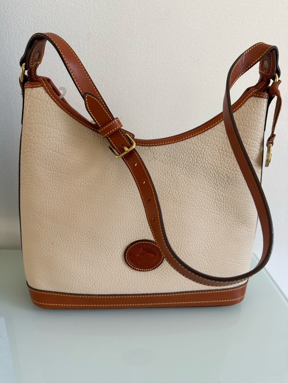 Dooney & Bourke Cream Pebbled Leather Shoulder Bag with Brown Trim